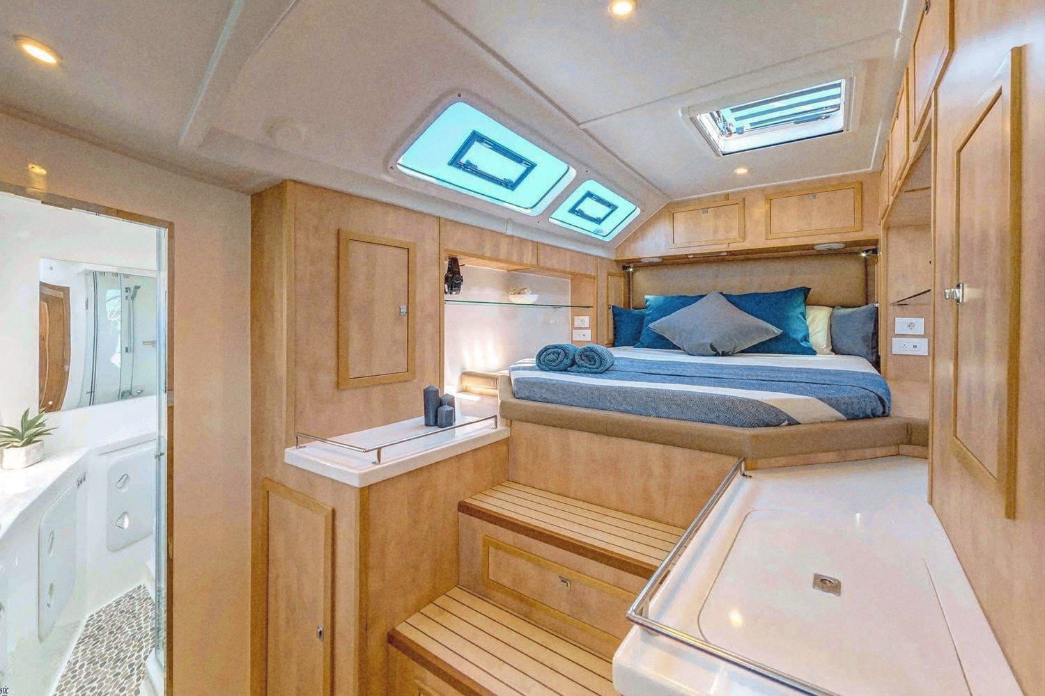 The master cabin with skylights open above the bed